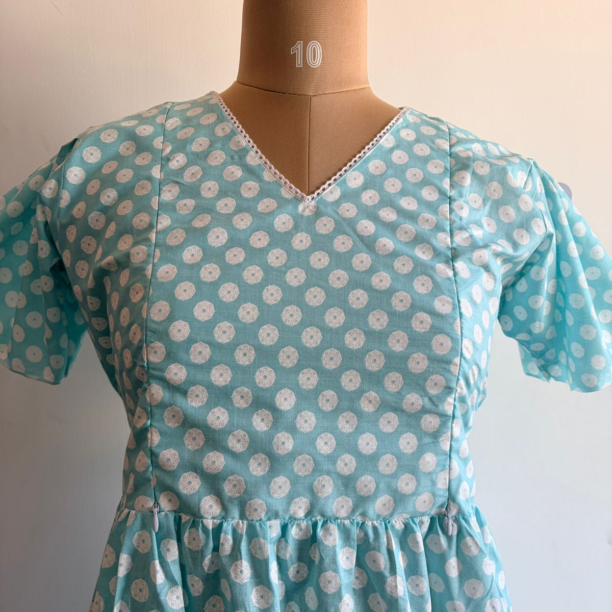 Blue Floral Printed Cambric Cotton V Neck Puff Sleeve Feeding Gown With Two Side Invisible Zip And Back Tie | Free Size |