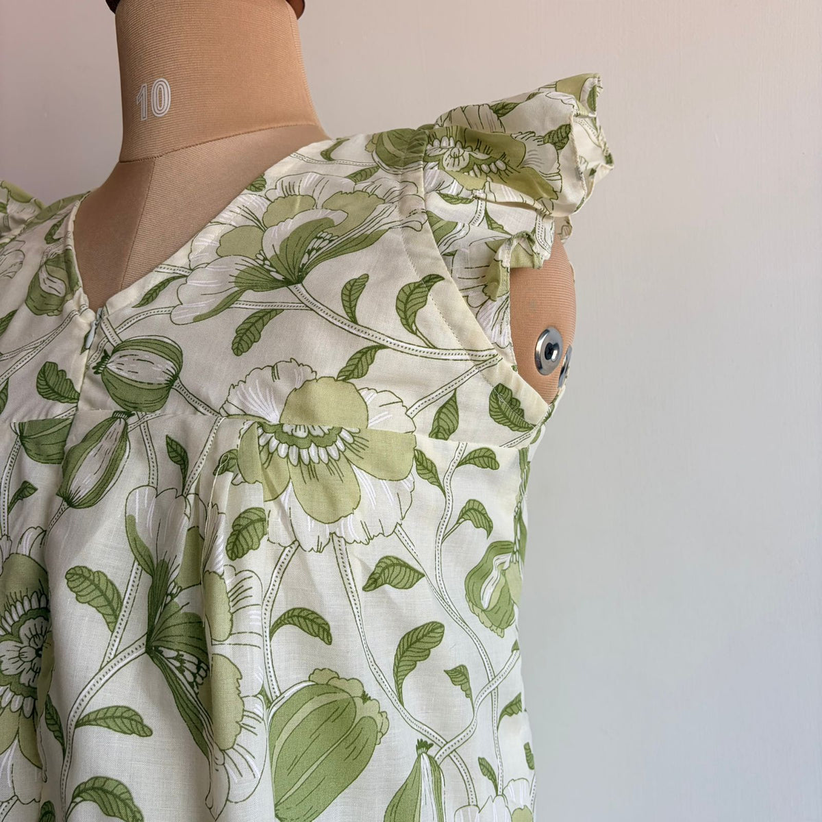 Green Floral Printed White Cambric Cotton V- Neck Ruffle Sleeve Long Zip Short Maternity Gown | Free Size | Chest Width 44″| Length 44″|